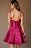 Dark pink satin mini dress with lace trim, structured bustier top, and flared skirt.








