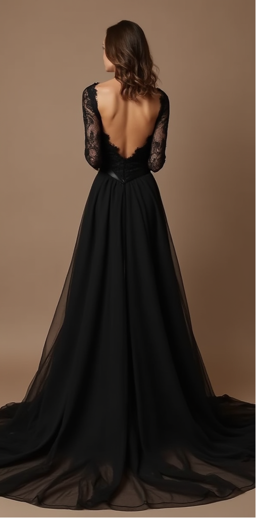 An elegant black wedding gown featuring an open-back lace design with a flowing chiffon A-line skirt and a subtle train – a vision of gothic romance.
فستان زفاف أسود أنيق يتميز بظهر مفتوح مزين بالدانتيل، مع تنورة شيفون منسدلة وقصة A-Line مذهلة – يجسد الرومانسية القوطية.
Un vestido de novia negro elegante con diseño de espalda abierta de encaje, falda fluida de chifón en A-Line y una sutil cola – una visión de romance gótico.