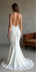 Luxury satin wedding gown with an open back, lace appliqués, and a flowing lace-trimmed train – a stunning choice for an elegant wedding. | فستان زفاف بظهر مكشوف مع تفاصيل دانتيل فاخرة وتنورة طويلة ساحرة | Vestido de novia con espalda descubierta y aplicaciones de encaje – una opción sofisticada. | Robe de mariée dos nu avec dentelle et traîne fluide – idéale pour une allure romantique.