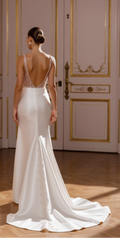 Modern Royalty: Plunging Satin Wedding Gown with High-Slit and Dramatic Bow Detail
